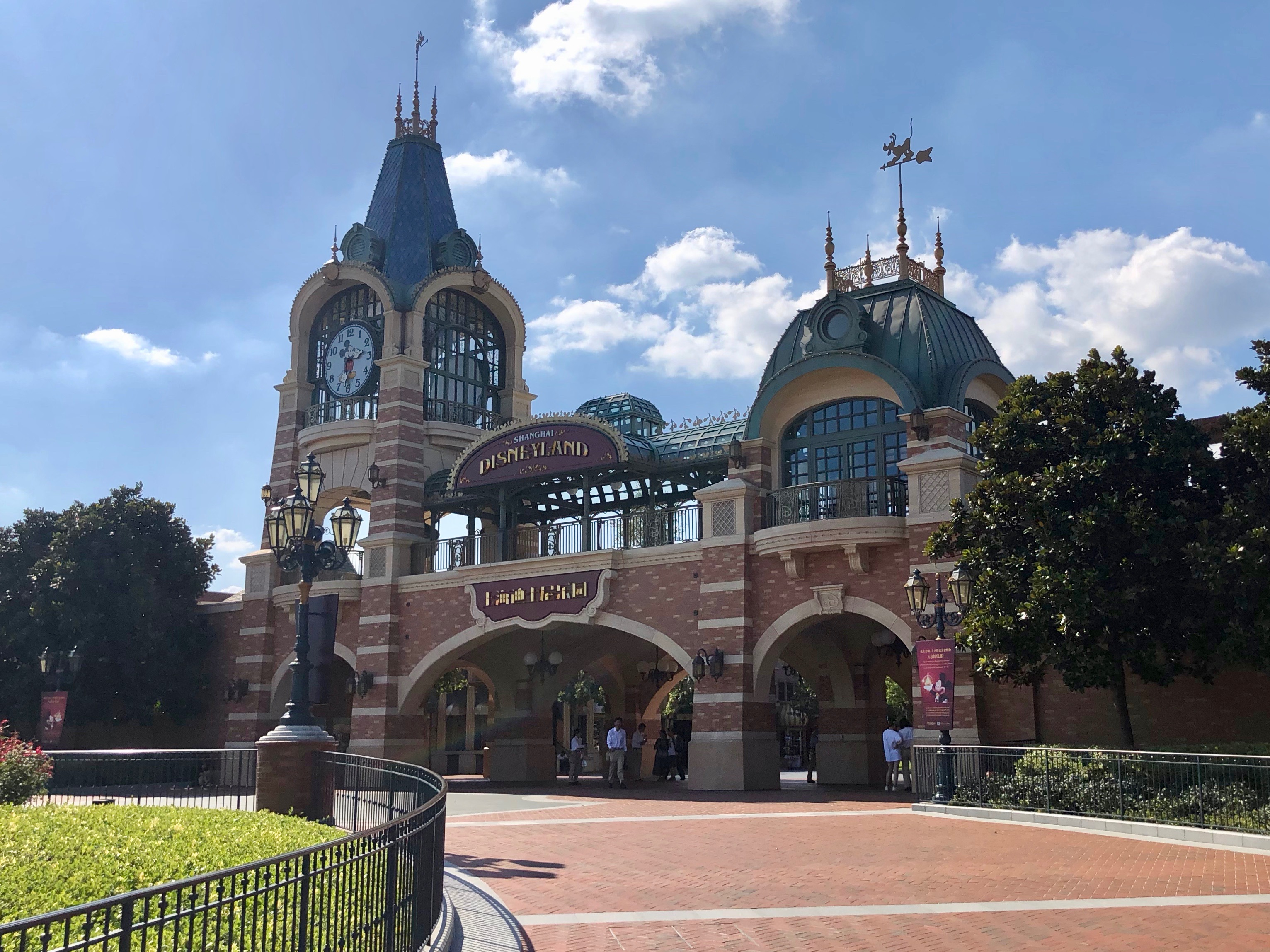 This building takes the place of the train stations in other Disneyland parks. Notice the Mickey Mouse clock on the tower.