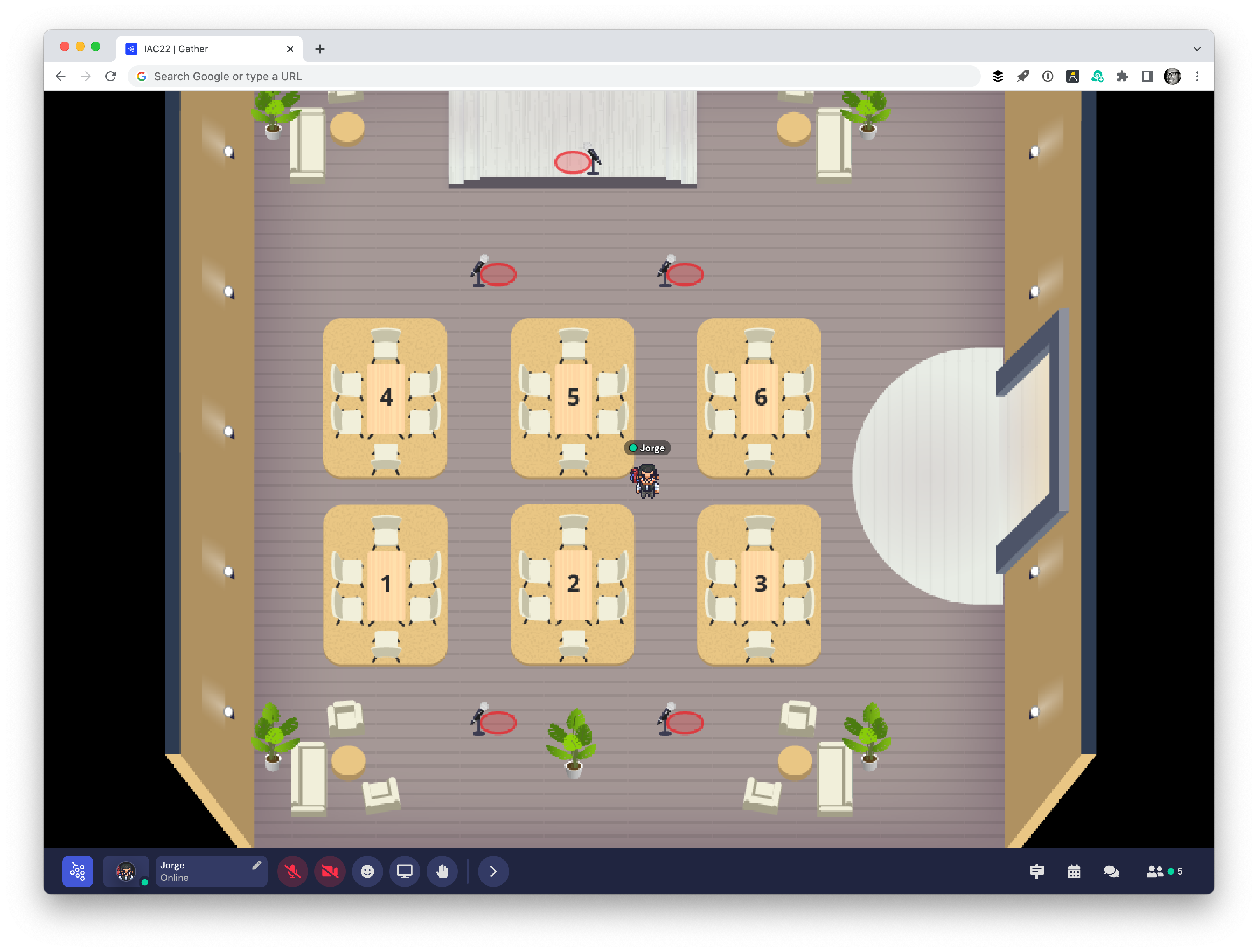 Screenshot of the Gather user interface, showing Jorge's avatar in the middle of an empty conference room.