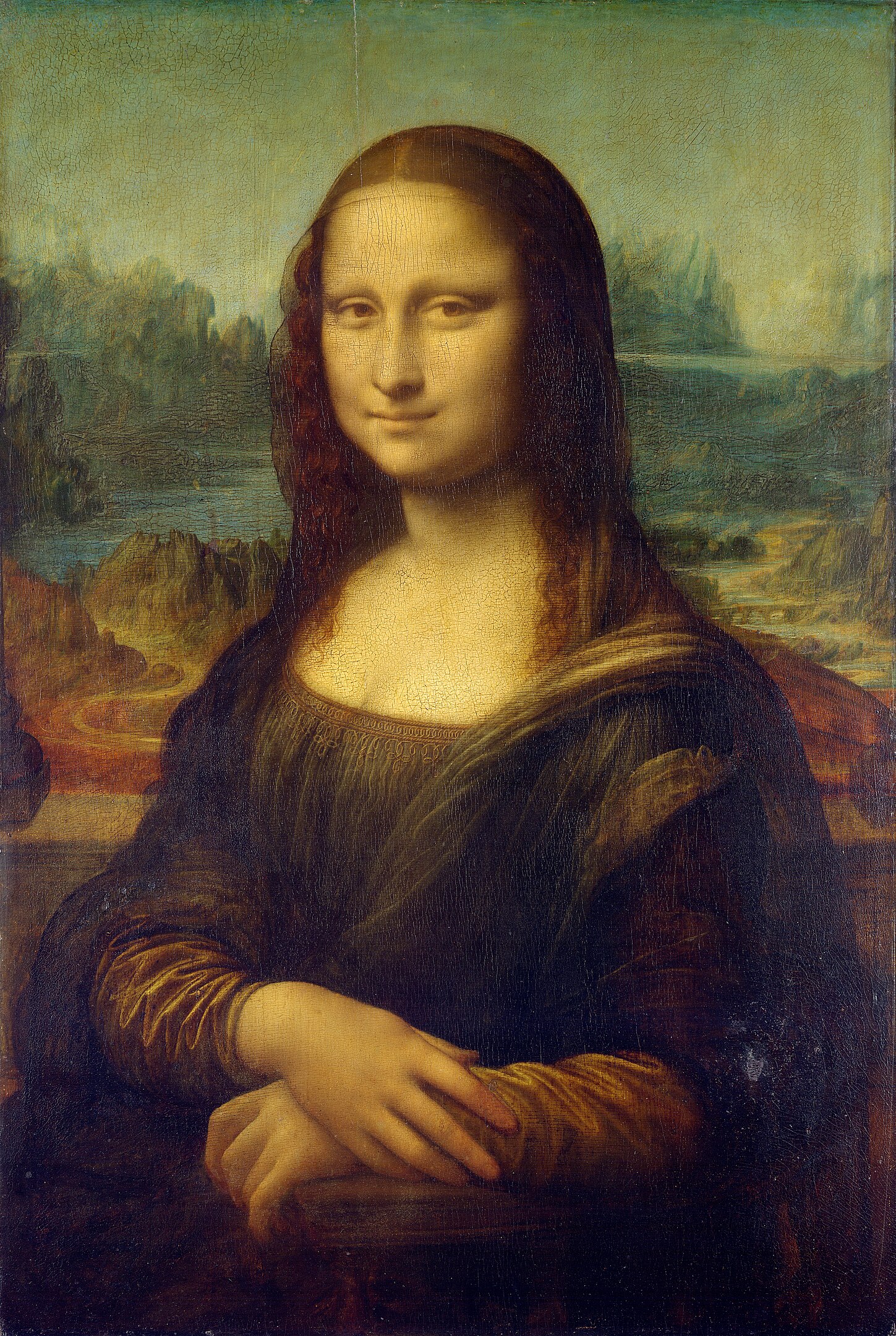Leonardo’s painting of the Mona Lisa: a portrait of a woman with a serene expression sitting with folded hands, wearing a dark dress against a blurred landscape background. *Mona Lis*a by Leonardo da Vinci via [Wikimedia](https://commons.wikimedia.org/w/index.php?curid=15442524)